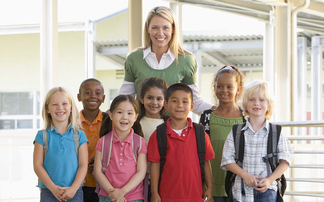 Elementary school teacher with students