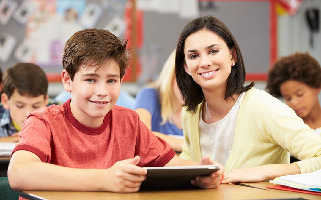 Smiling student with teacher